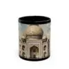 The Taj Mahal Coffee Mug is a ceramic mug with a black rim and interior, featuring a detailed artistic illustration of the Taj Mahal—perfect as a unique travel mug or gift for art lovers.